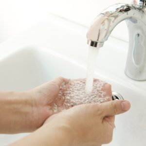 Human Hands Being Washed Under Stream Of Pure Water From Tap